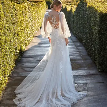 2023 Gyönyörű sellő esküvői ruha V-nyakú hosszú lámpás ujjú flitteres csipke rátétes menyasszonyi ruha gomb vissza Vestidos De Novia